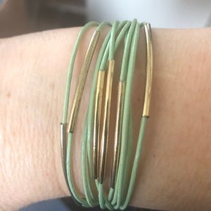 Light green strand bracelet.